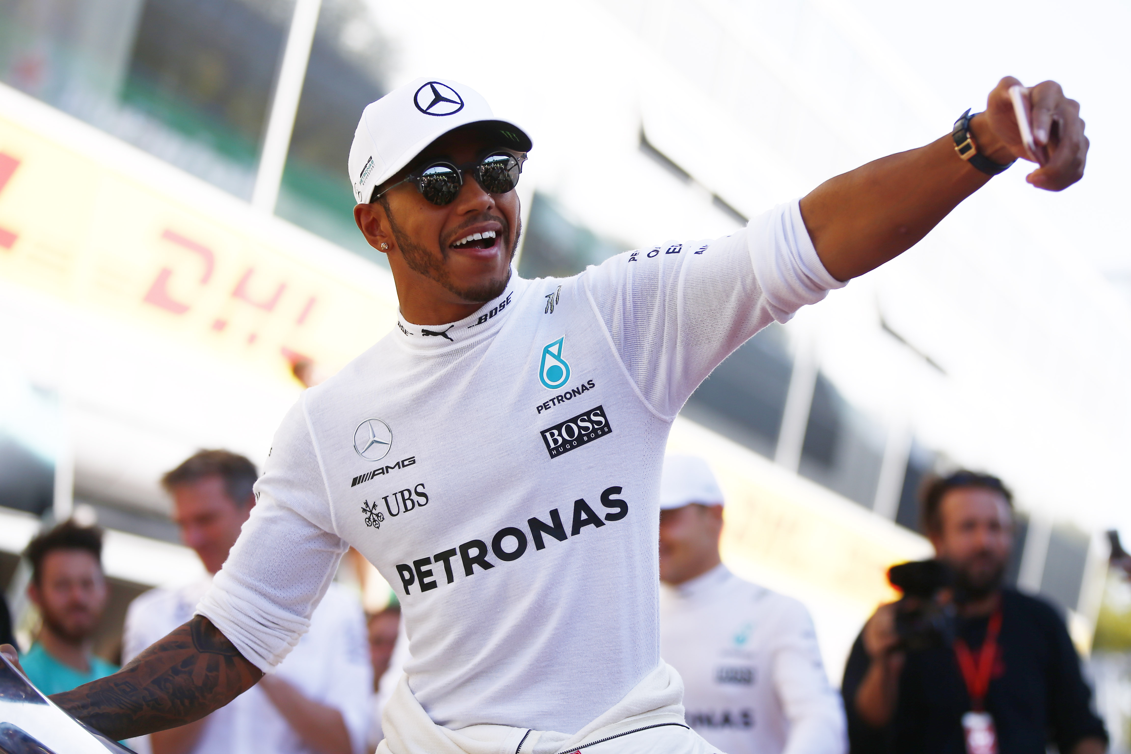 F1 fans ask 'is he single' as Lewis Hamilton rocks up at Brazilian