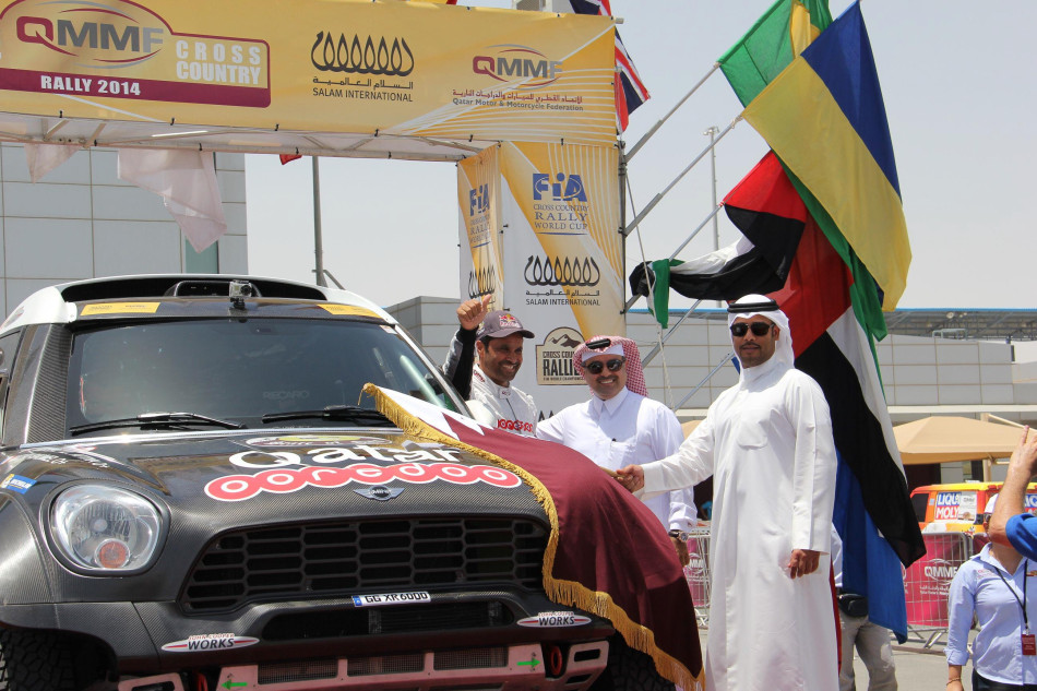 Qatar's Nasser Saleh Al-Attiyah is flagged away from the start of his home event